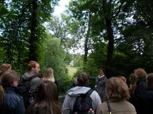 Photo of the group members exploring Weimar and listening to their guide.