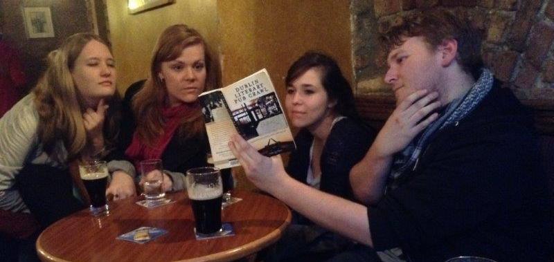 Photos of group members having pints of Guinness in a pub and watching an Irish dance show. Photos of group members having pints of Guinness in a pub and watching an Irish dance show.