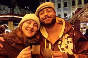 Photos of participants of “Bamberg Buddies” at different seasonal events, like the Christmas market or at a beer garden.