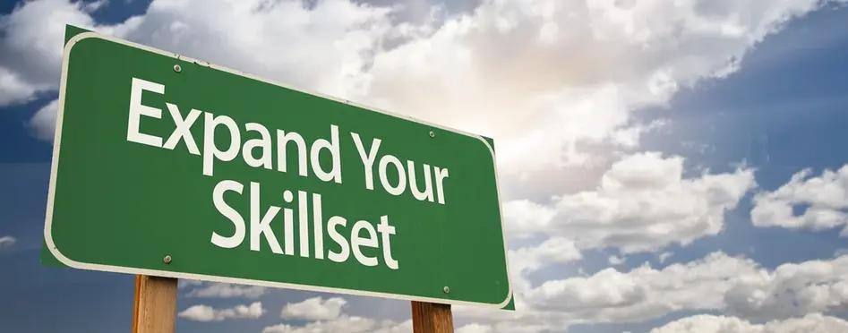 Expand Your Skillset Green Road Sign with Dramatic Clouds and Sky.