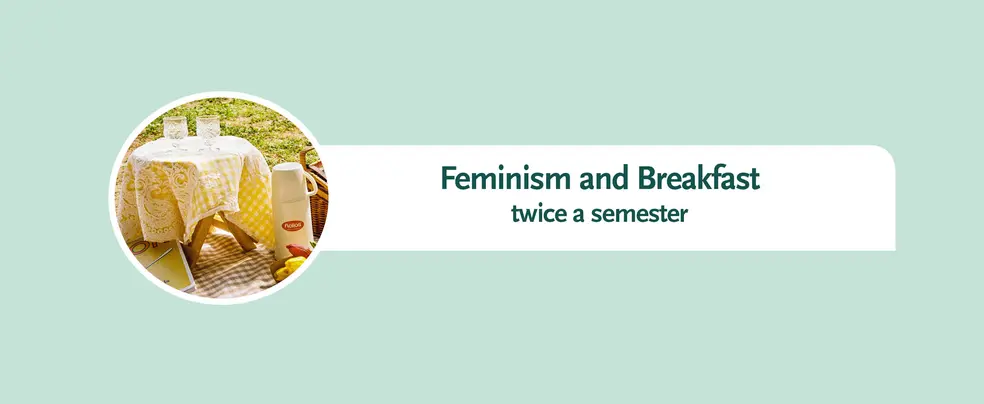 This is a banner with a light turquoise background for the page 'Feminism and Breakfast'. In a small circular picture show picnic utensils. A picnic blanket with a white and brown checkered pattern lies on the grass with a book, fruit, a vacuum flask and a basket. There is a small table with two glasses and a yellow tablecloth standing on the picnic blanket.