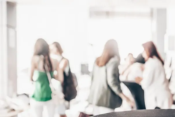 Blured image of businesspeople at coffee break at conference meeting.