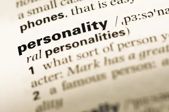 Close up of old English dictionary page with word personality.