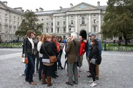 Photo of the group exploring Dublin and listening to their guide.