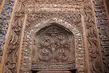 Zuzan (Iran), carved stucco mihrab with extensive traces of polychromy.