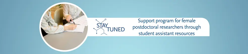 This is a banner with a blue background for the page 'StayTuned - a support program for female postdoctoral researchers through student assistant resources to navigate challenging periods'. In a circular image, two women can be seen sitting, one of them holding a pen while papers lie on the table.