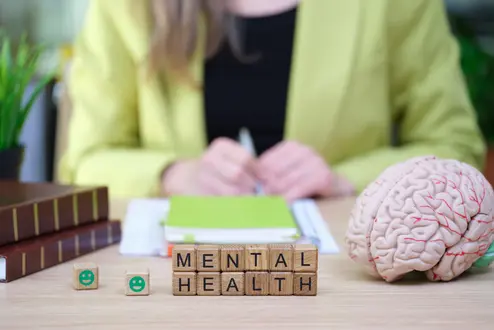 Exploring mental health through understanding, awareness, and support during a bright afternoon in a serene workspace