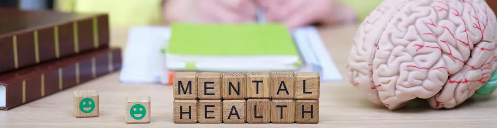 Exploring mental health through understanding, awareness, and support during a bright afternoon in a serene workspace