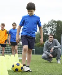 Coach Leading Outdoor Soccer Training Session Coach Leading Outdoor Soccer Training Session