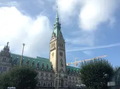 Photos of different sights around Hamburg, including the city hall and the harbour.