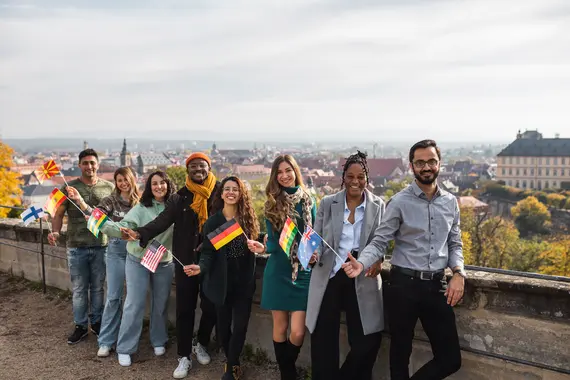 International students in front of the city panorama International students in front of the city panorama