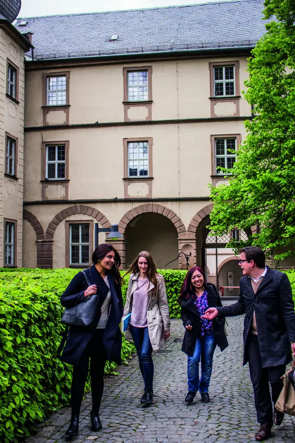 MA students in the courtyard of building U2